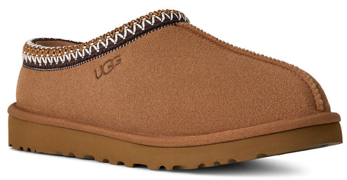 Tan-colored slipper with a decorated trim.