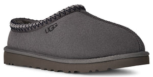 Charcoal slipper with woven trim around the opening and a brown sole; the letters UGG are visible on the side.