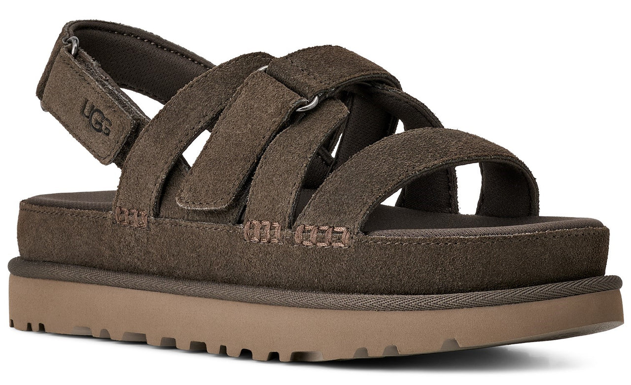 Brown suede sandal with velcro straps and a platform sole.