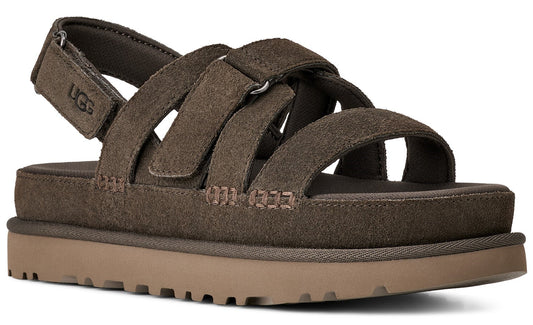 Brown suede sandal with velcro straps and a platform sole.