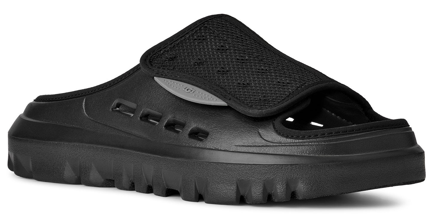 Black slide sandal with thick lug sole and breathable top.