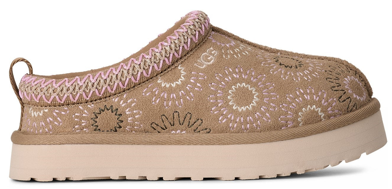 A slip-on shoe with a thick, light-colored sole and patterned taupe upper.