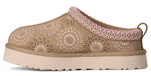 Tan slip-on slipper with pink and white flower pattern, woven trim, and a light-colored platform sole.