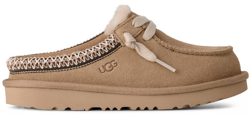 A tan slipper with laces and a brown and white patterned trim.