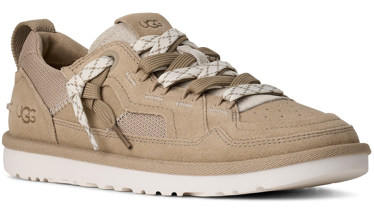 Tan suede sneaker with white laces and a white rubber sole.
