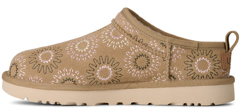 Tan UGG Tasman slipper with a floral design.