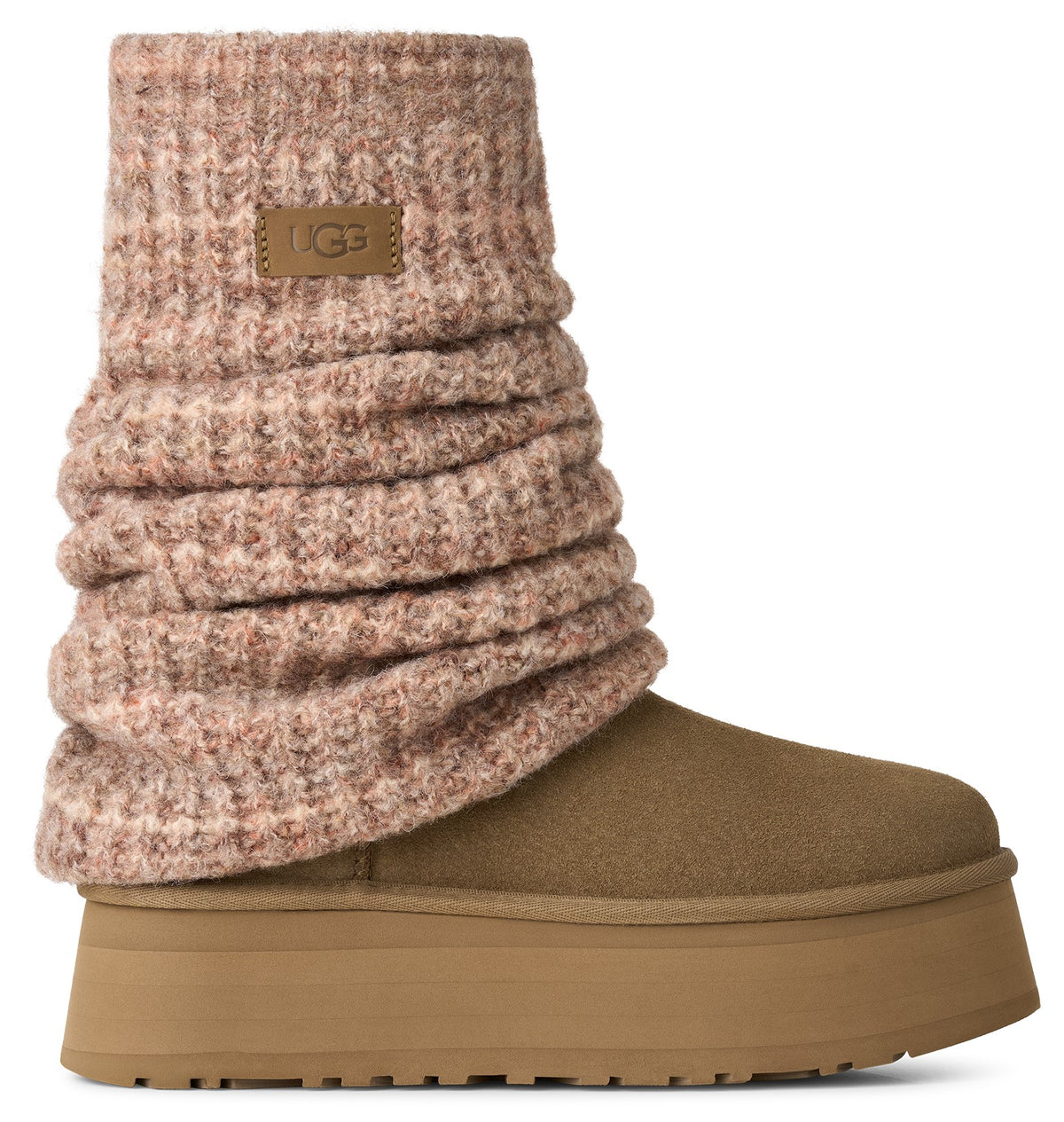 A tan suede platform boot featuring a thick, heathered pink-and-brown knit cuff that extends up the ankle with a small rectangular label on the cuff that says UGG.