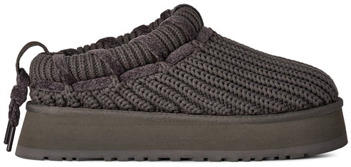 A dark charcoal grey, thick-soled, slip-on platform shoe with a knit-texture upper and a decorative braided drawstring detail at the heel.
