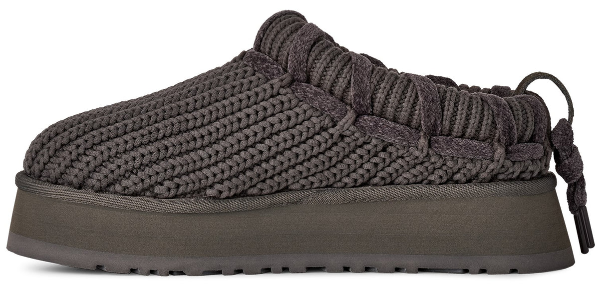 A dark charcoal grey knit mule with a thick, matching platform sole and a pull tab at the heel, featuring a textured corded upper design.