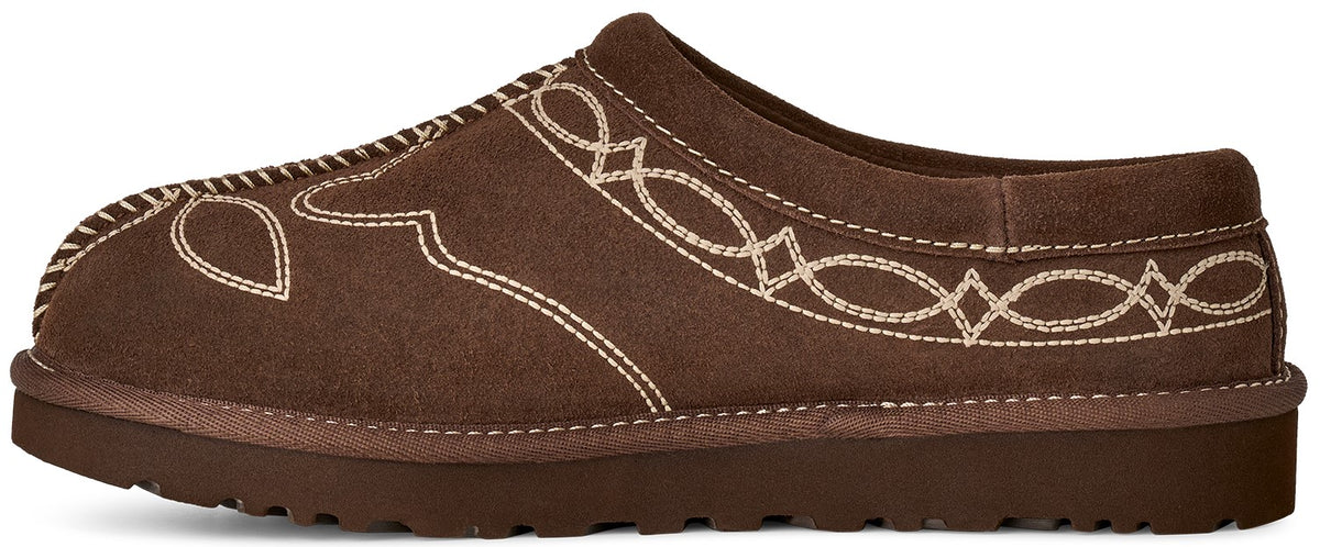 A brown suede slip-on shoe with an embroidered Western-style pattern in cream stitching.
