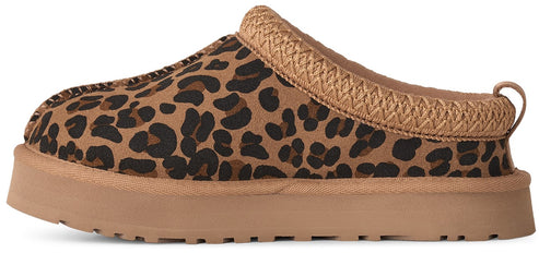 A slip-on slipper with a leopard-print upper, a thick tan platform sole, and a woven braided trim along the collar.