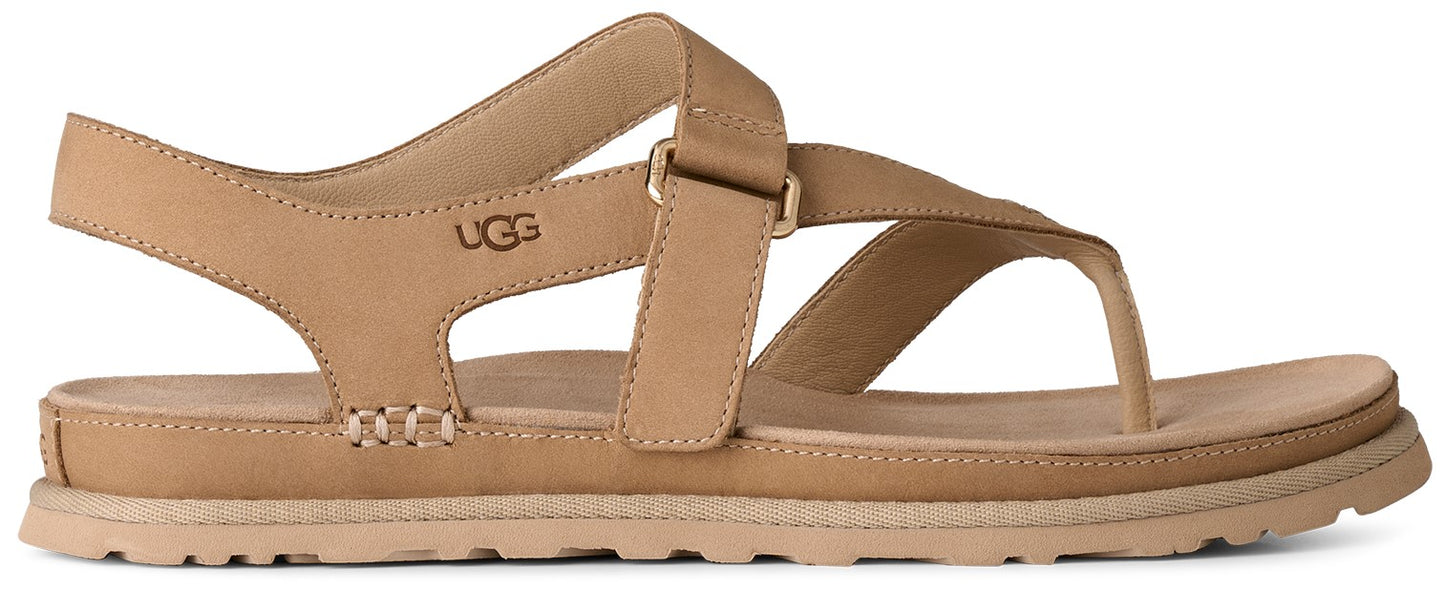 Tan leather sandal with UGG logo.