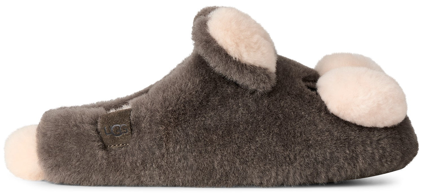 A gray fuzzy slipper with a light cream-colored pom-pom on the toe, a matching pom-pom on the heel, and a small cream-colored ear shape attached to the top of the slipper.