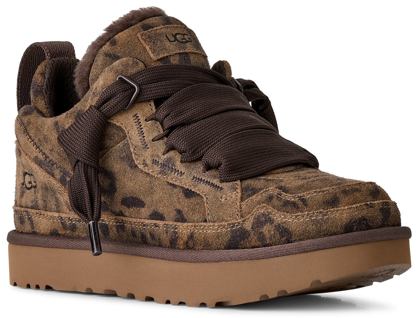 A brown leopard-print suede sneaker with wide dark brown ribbon laces, a thick platform sole, and a visible UGG logo on the tongue and side heel.