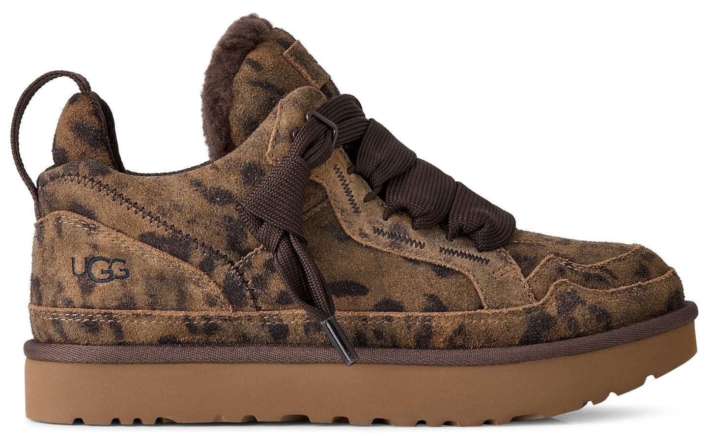A brown leopard-print suede low-top sneaker with thick brown laces and a wide, tan rubber platform sole. The shoe features a pull tab at the heel, a plush interior, and the text 'UGG' embossed on the outer heel area.