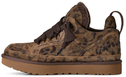 A brown and tan leopard-print suede sneaker with wide, dark brown laces, a thick tan rubber platform sole, and a dark brown faux-fur lining visible at the collar.