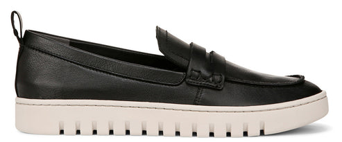 A black penny loafer with a thick white sole and a small loop at the back of the heel.