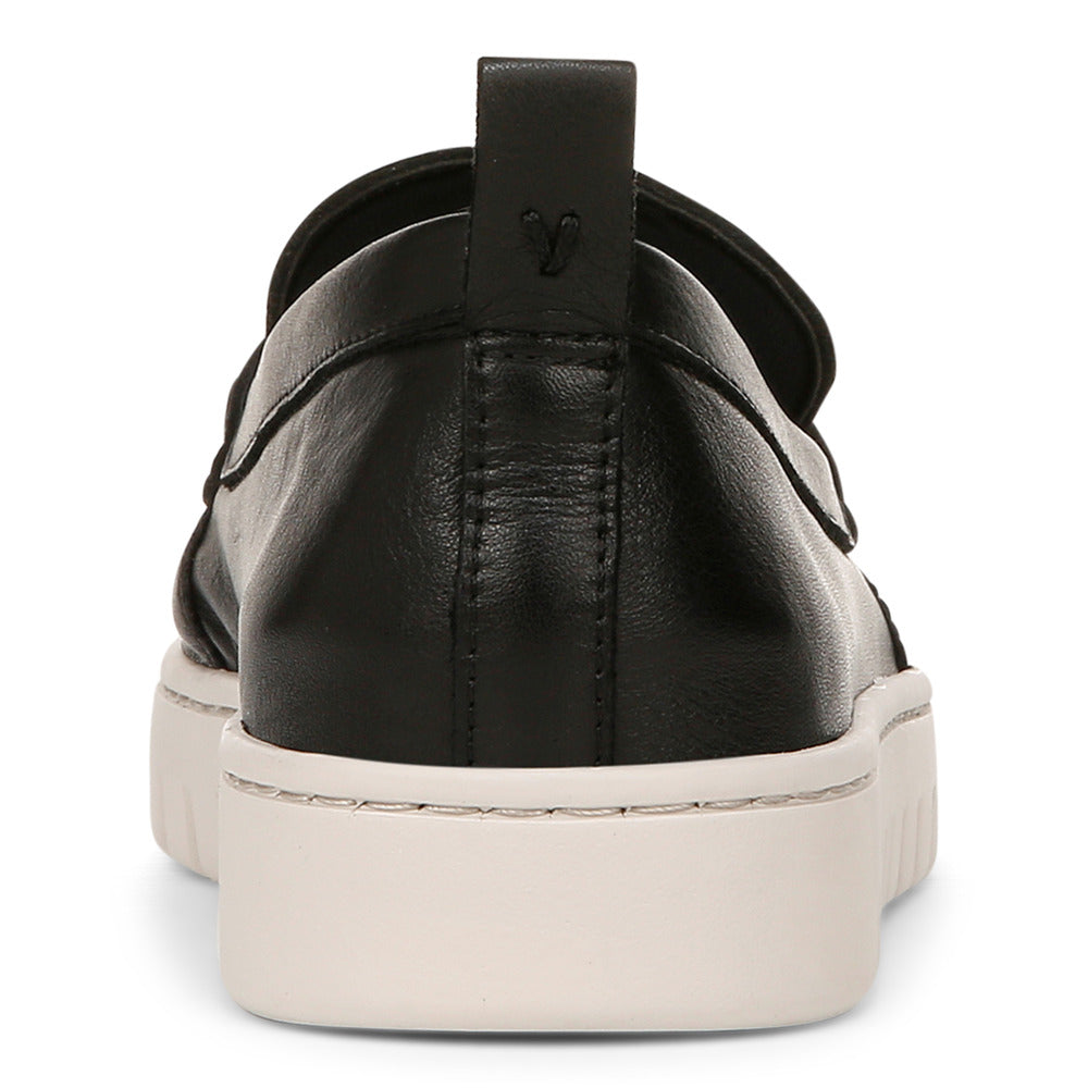 Black loafer with a white platform sole.