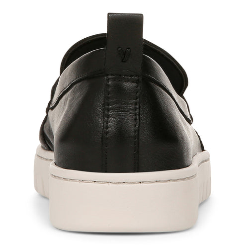 Black loafer with a white platform sole.
