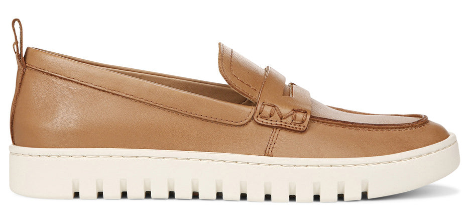Tan-colored loafer-style shoe with a white, lugged sole.