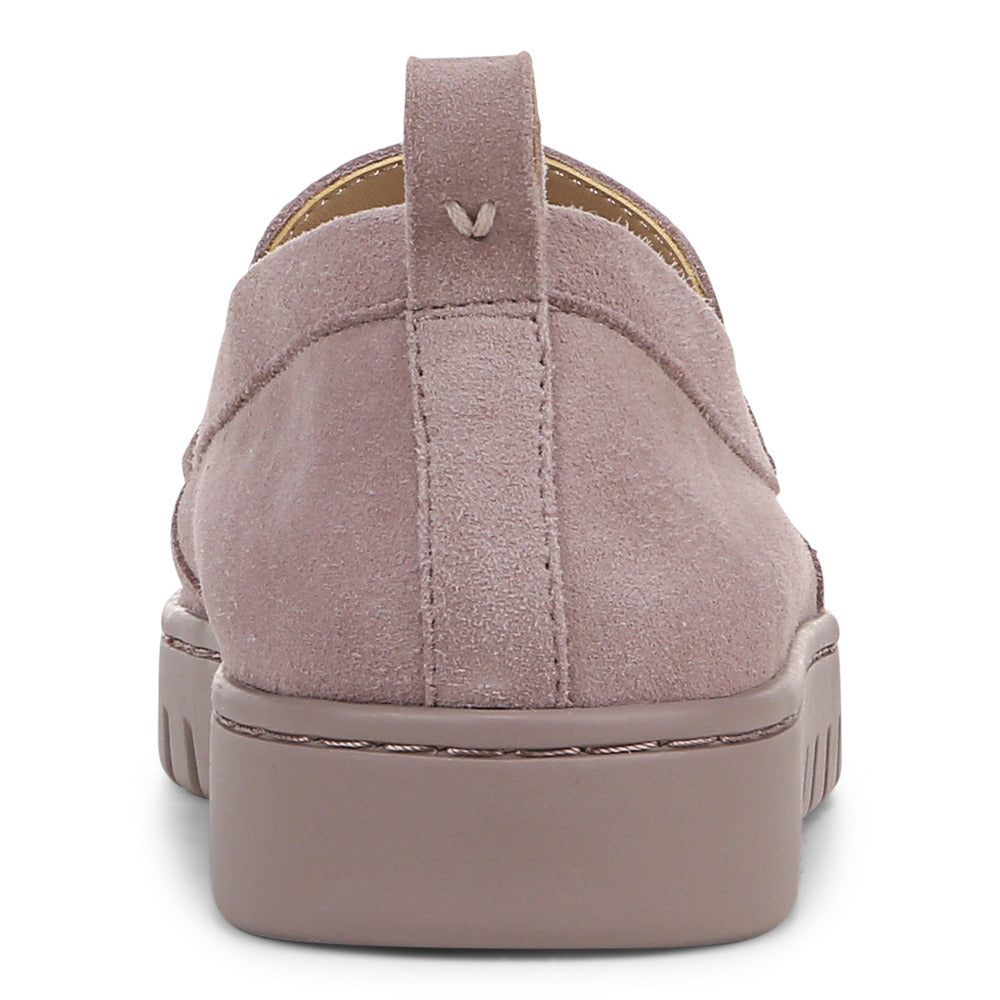 Low, mauve suede shoe with thick sole and pull tab, rear view.