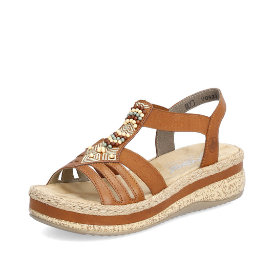 Brown sandal with beaded strap and platform sole.