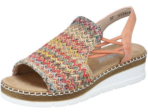 Open toe sandal with woven colorful upper, white platform sole, and peach straps.