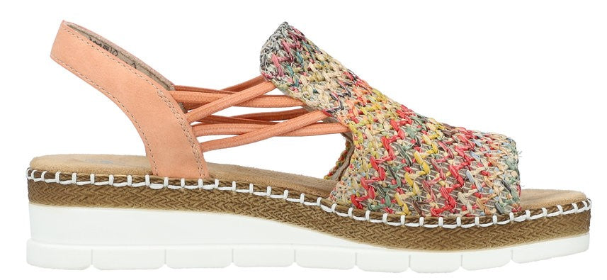 A sandal with a colorful woven upper and peach-colored straps and heel, atop a platform sole with white and brown layers.