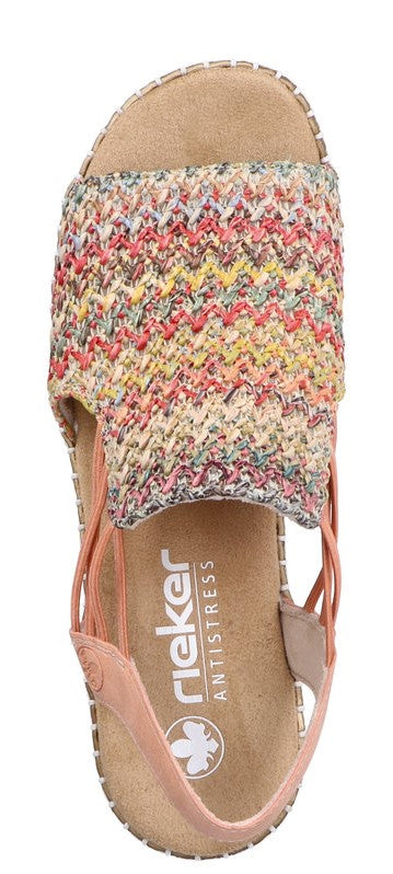 A sandal with colorful woven upper and peach-colored straps.