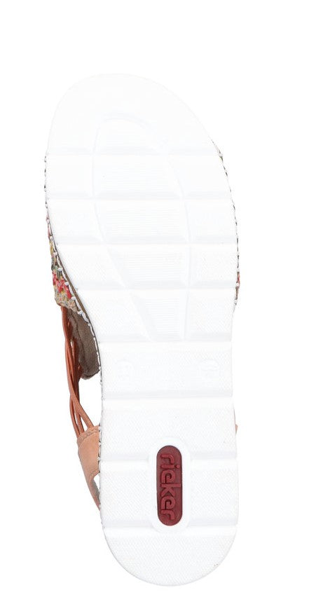 Bottom view of a white sole with tread, red capsule shaped logo.