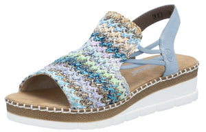 Wedge sandal with woven blue, white, and brown upper, light blue straps and white sole.