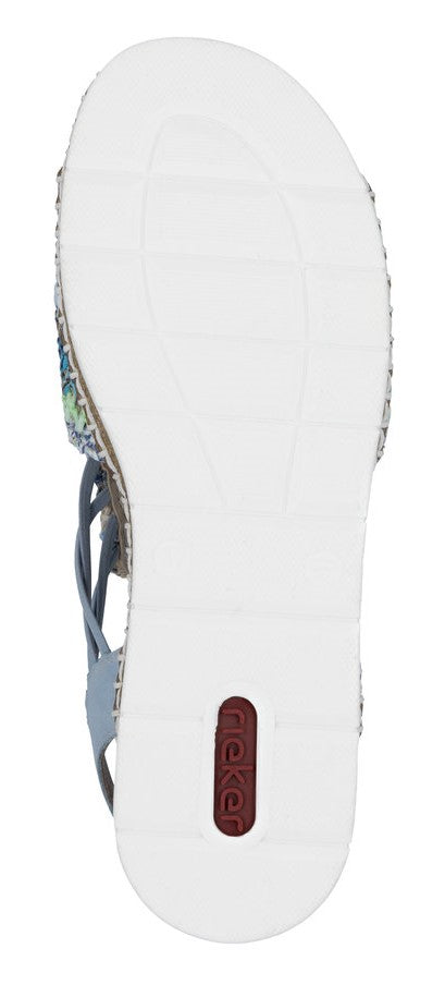 The sole of a sandal is white with a dark logo towards the heel.