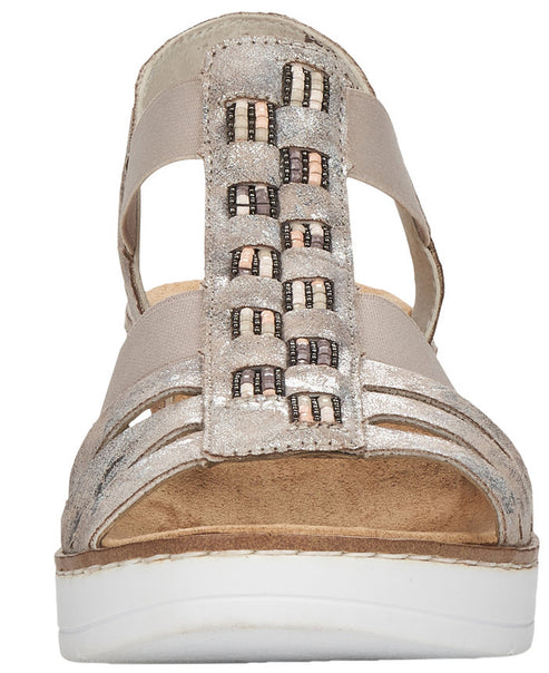 Front view of a platform sandal with metallic leather straps interwoven with decorative woven strips.