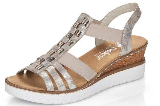 Women's T-strap wedge sandal with woven metallic straps, elastic heel strap, and white sole.