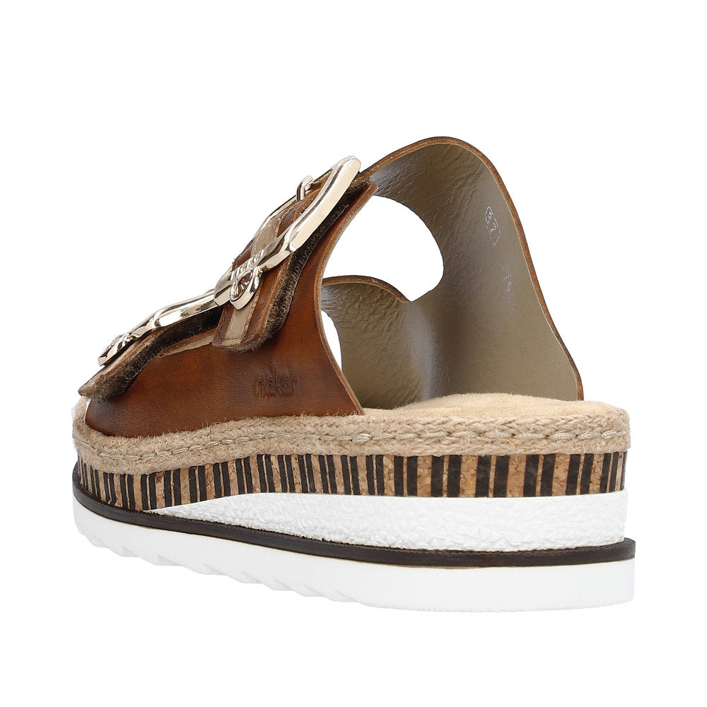 Back view of a brown sandal with a silver buckle and a thick, layered sole featuring a striped design.