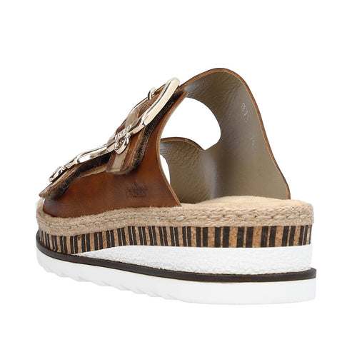 Back view of a brown sandal with a silver buckle and a thick, layered sole featuring a striped design.