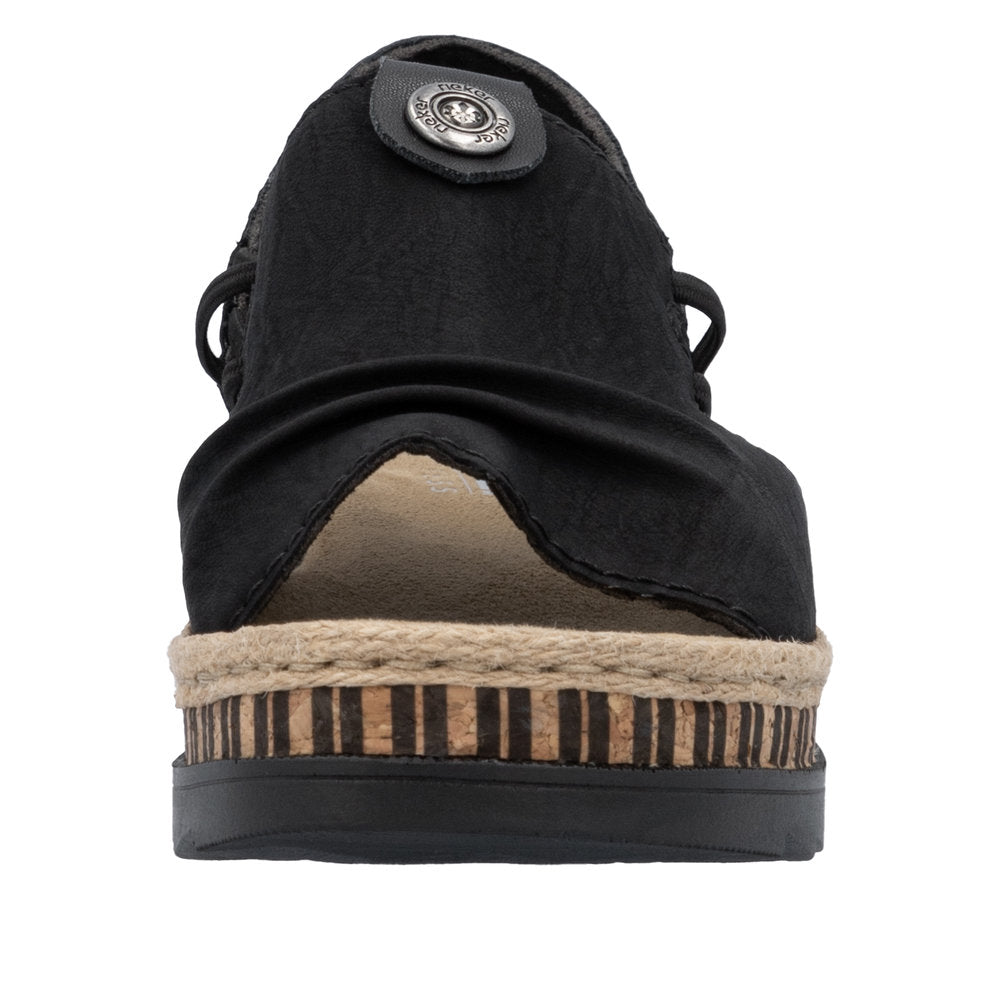 Front view of a black sandal with a decorative button, rope trim, and striped platform.