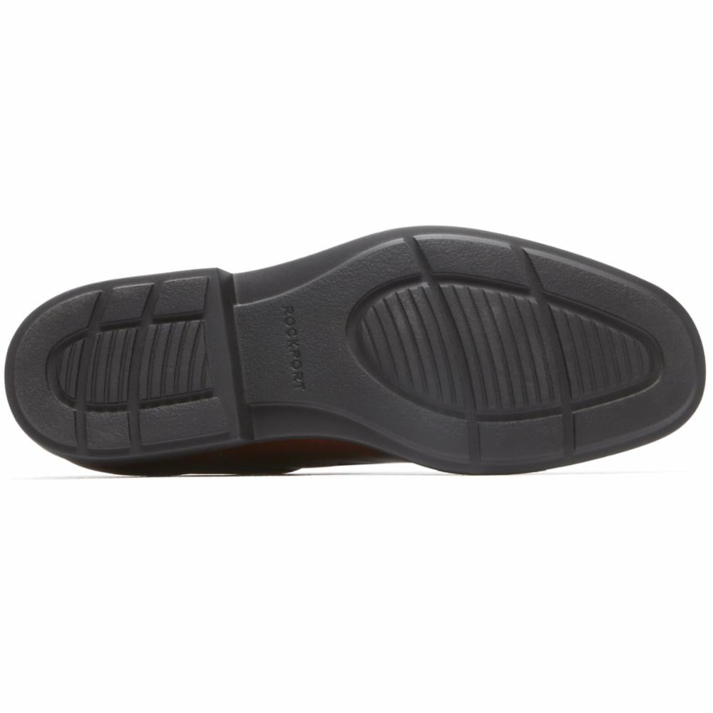 Black shoe sole with "ROCKPORT" text and ridged pattern.