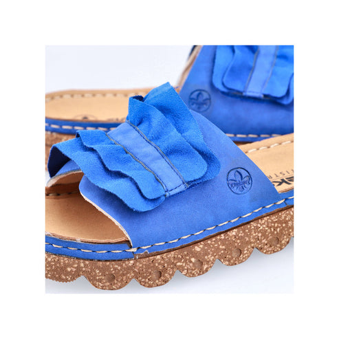Close-up of a blue sandal with ruffled details on a cork sole.