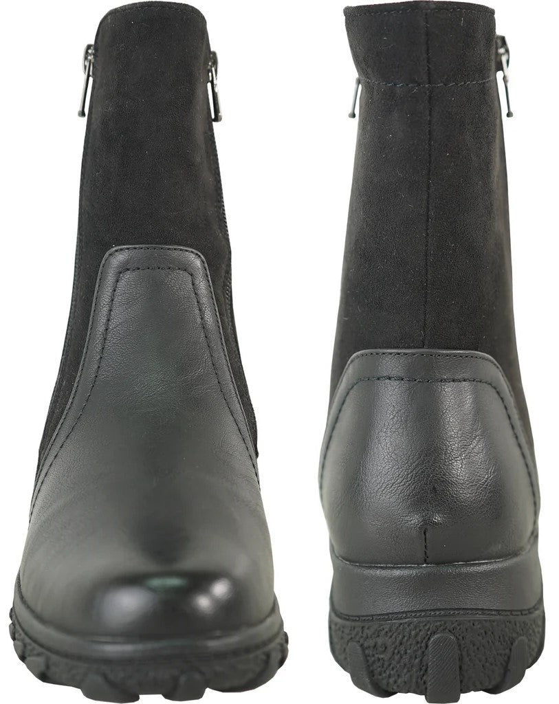A pair of black ankle boots, shown from the front and back, featuring a mix of smooth faux leather at the base and suede-like material on the upper shaft, with side zippers and lugged rubber outsoles.