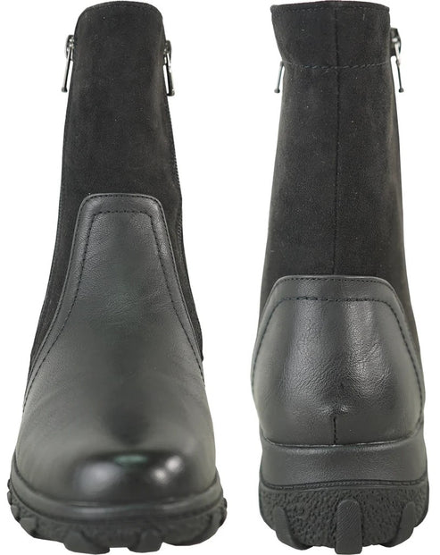A pair of black ankle boots, shown from the front and back, featuring a mix of smooth faux leather at the base and suede-like material on the upper shaft, with side zippers and lugged rubber outsoles.