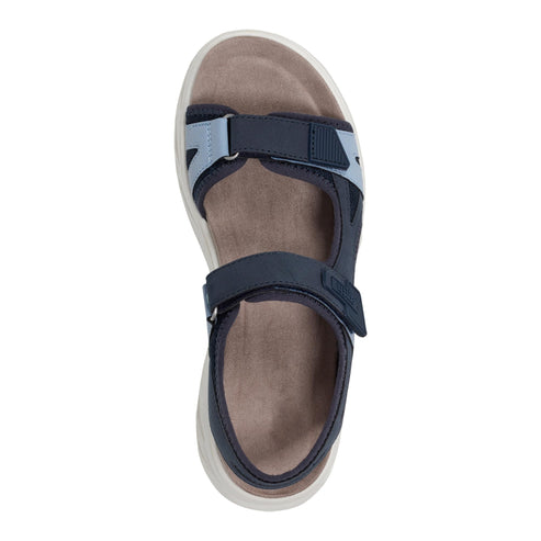 Navy sandal with velcro straps and a light brown sole.