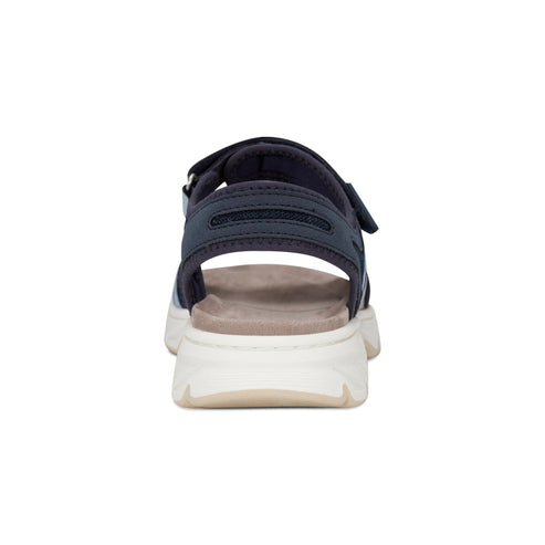 Navy blue sandal with velcro straps and thick white sole, back view.