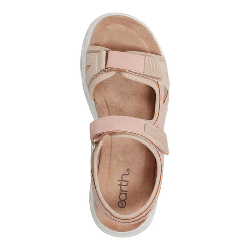 Top-down view of earth. brand pink sandal with two hook and loop straps and a white platform sole.