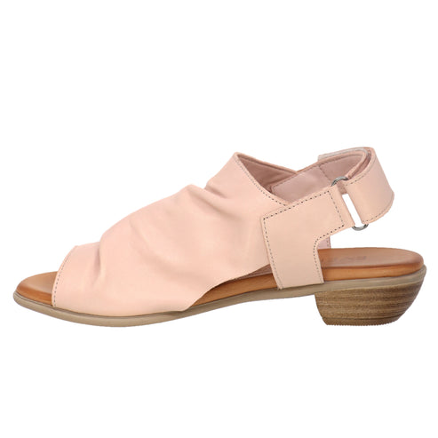 Peach low heel sandal with open toe and slingback strap.