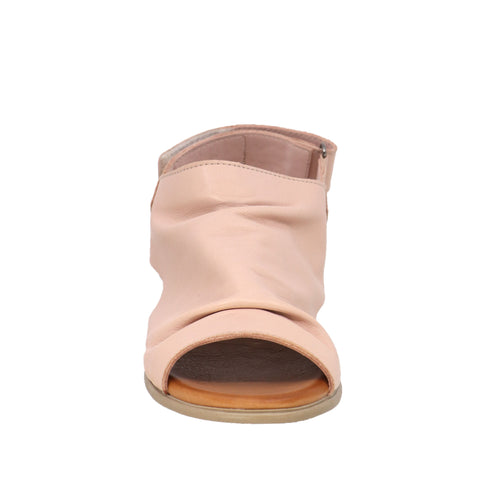 Close-up of a pink, open-toed bootie-style sandal with a low heel.