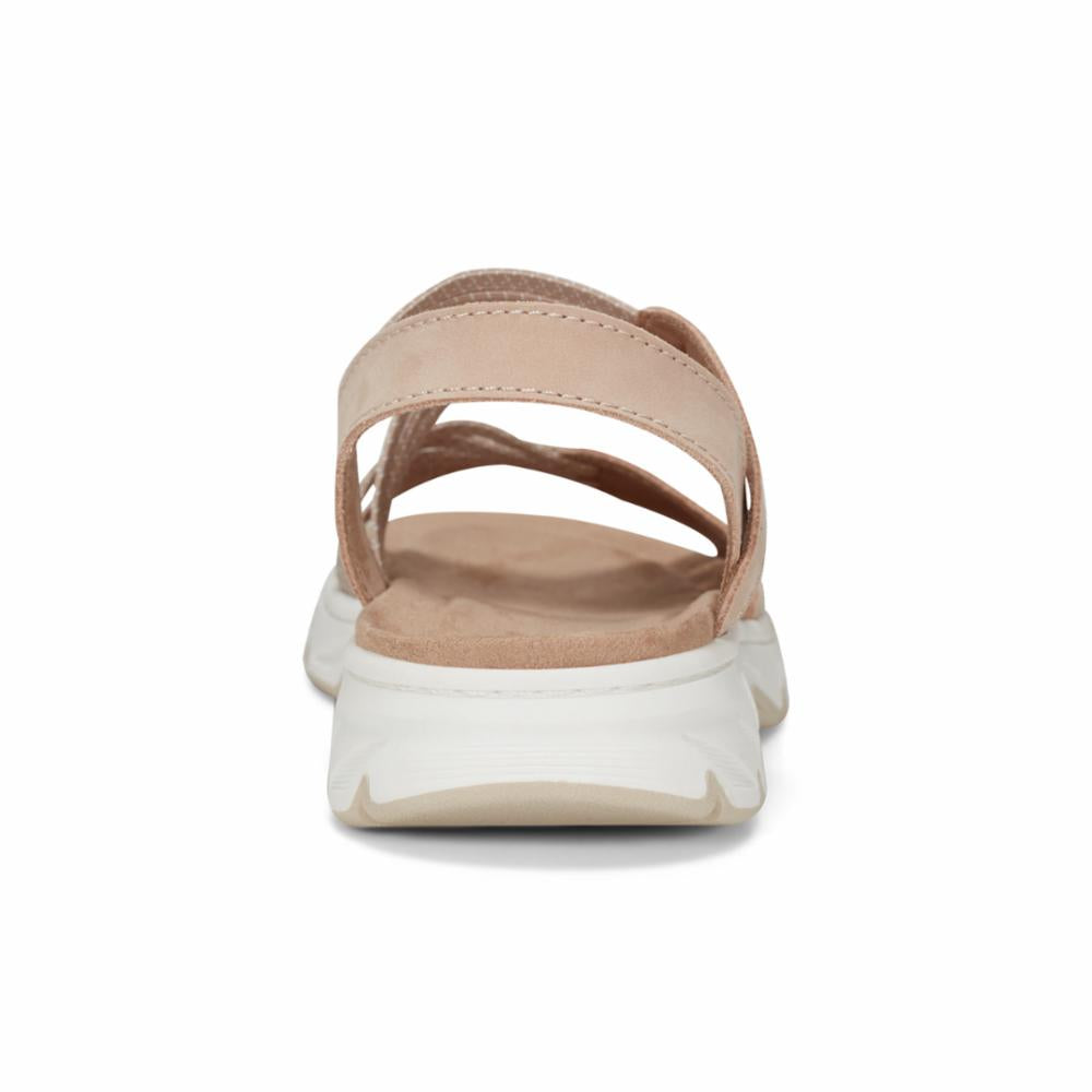 Open-toed light pink sandal with white sole and adjustable straps.