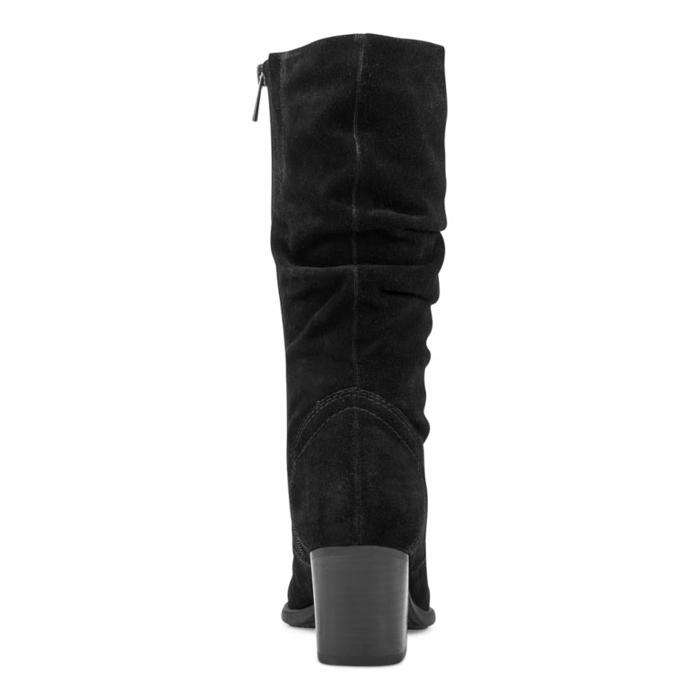 Black knee-high slouch boot with a block heel and side zip.