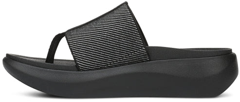 A black sandal with a toe post and a thick sole.