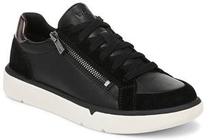 A black leather and suede lace-up sneaker with a side zipper, metallic heel detail, and a thick white rubber sole.